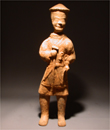 A Sichuan Pottery Figure of a Farmer