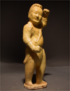 A Straw Glazed Pottey Figure