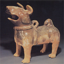 An Amber-Glazed Red Pottery Figure of a Dog