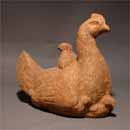 A Pottery Hen with a Chicken 
