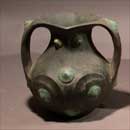 A Pottery Amphora with Bronze Decor