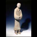 A Painted Grey  Earthenware Figure        