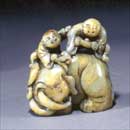 A Yellow Jade Elephant with Two Boys