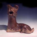 An Amber-Glazed Red Pottery Figure of a Seated Dog