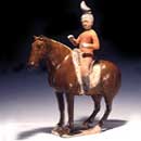An Amber Glazed Painted Pottery Horse with Rider