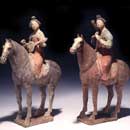 A Pair of Painted Pottery Figures of Equestrian Female Musicians